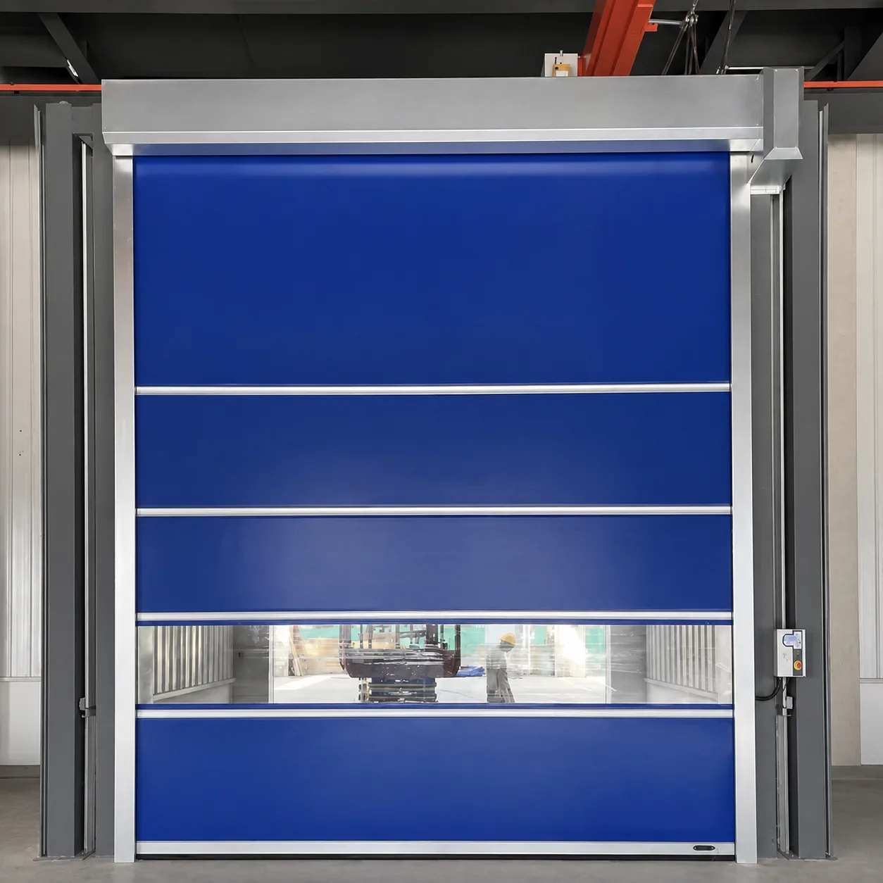 Blue PVC high speed door with wind bars and a vision strip in a steel-frame factory building