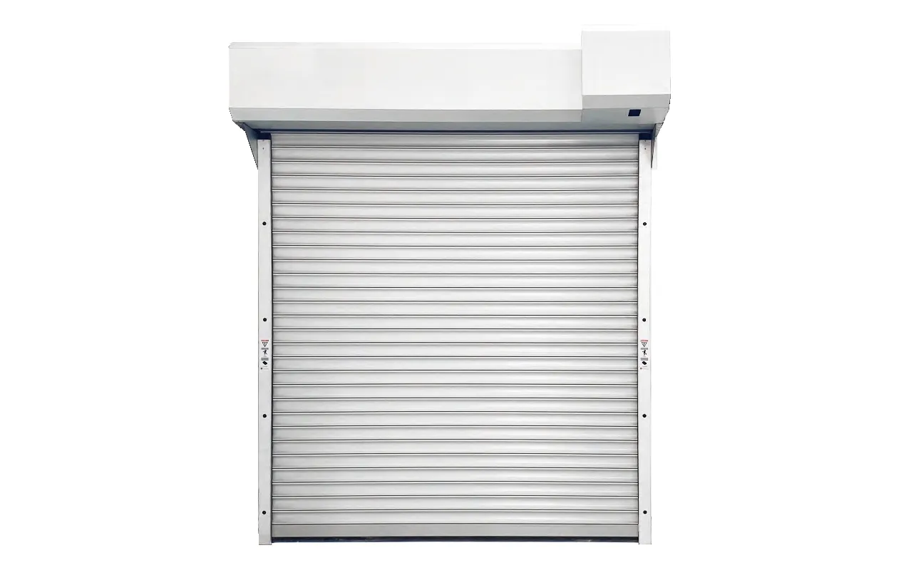 White steel roller shutter with hood, front view, warning labels on the guide rail (catalogue image)