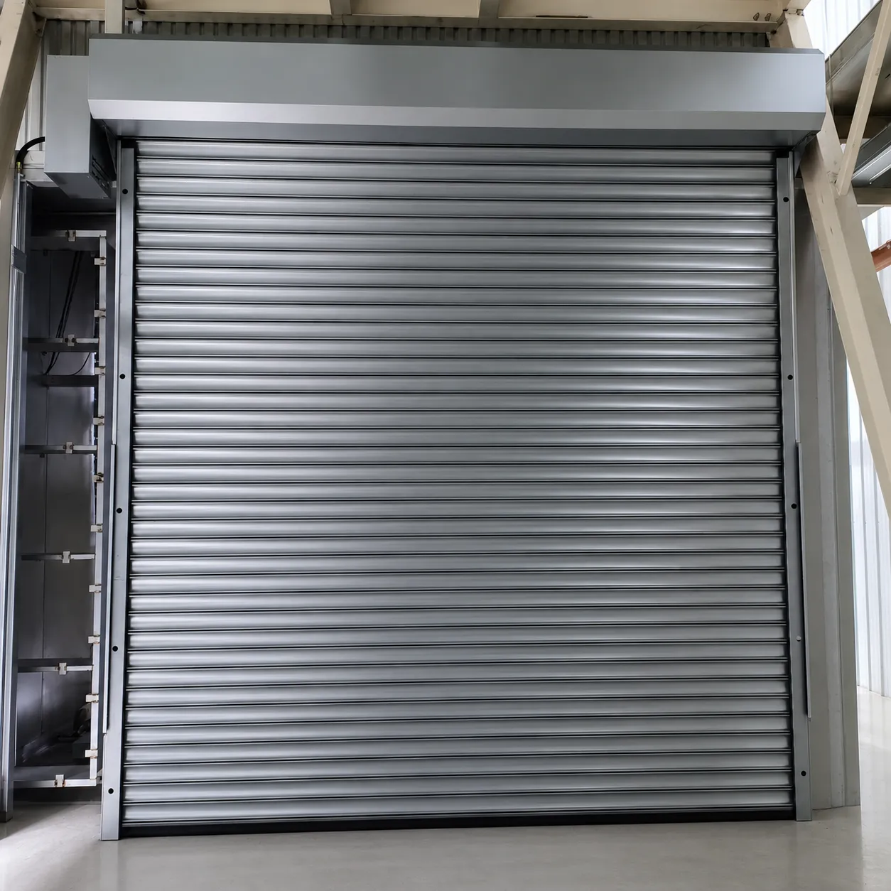 Steel roller shutter with hood beneath a steel platform, front view